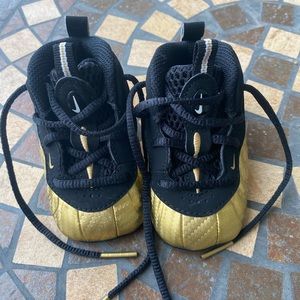 Hold and black Nike toddler shoe